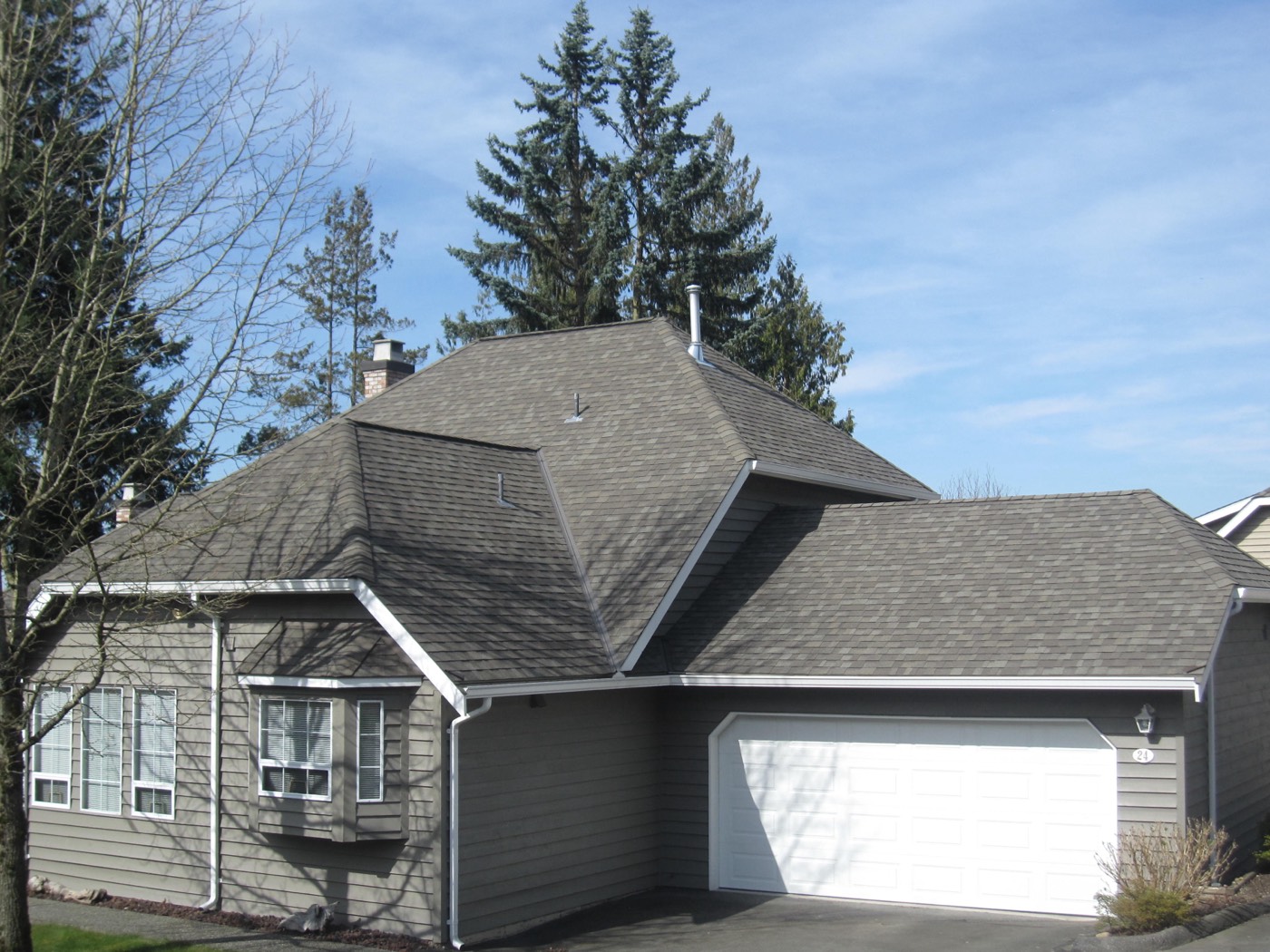 Home with dormer and attached garage