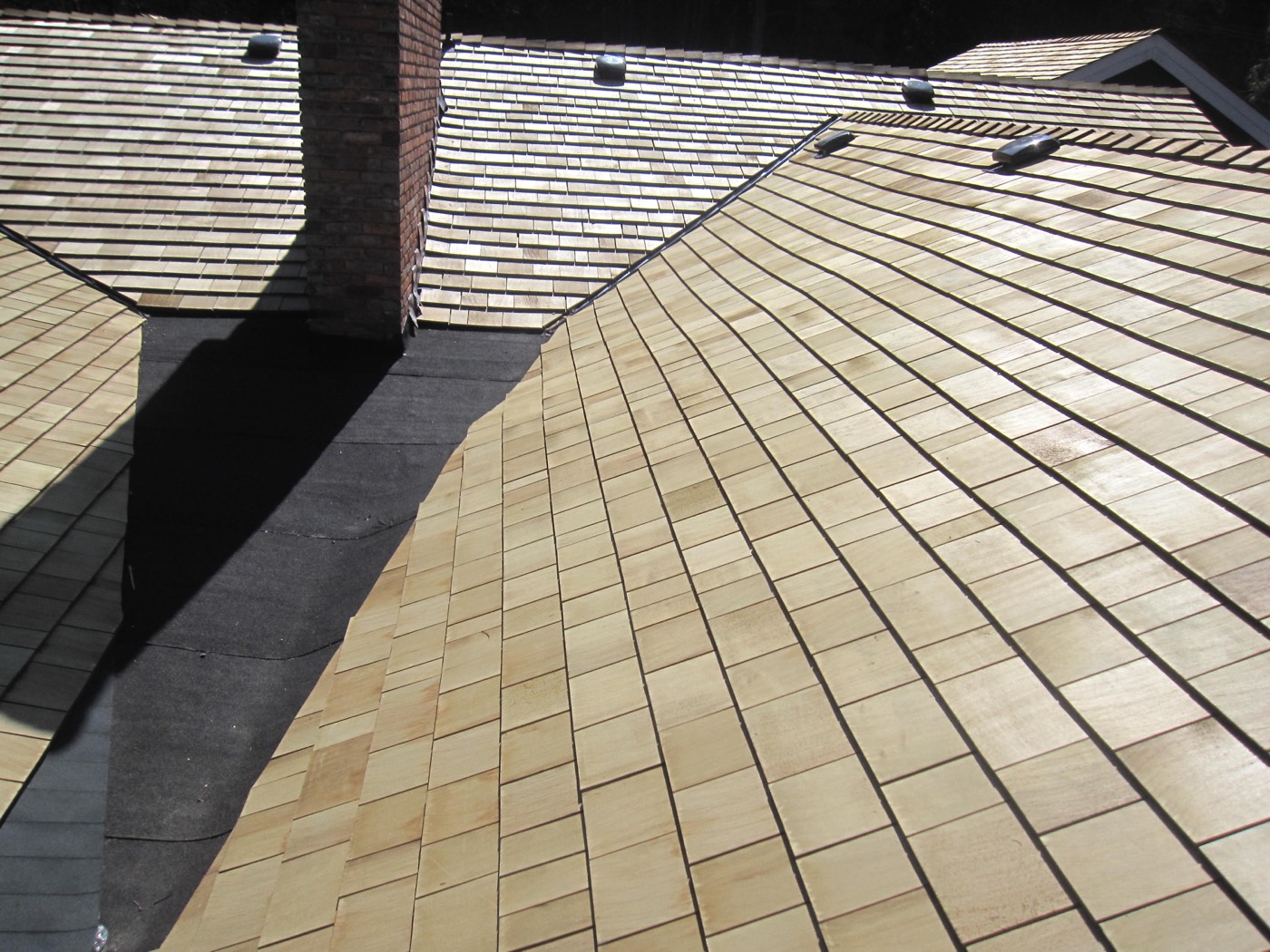Cedar shake roof across a full elevation